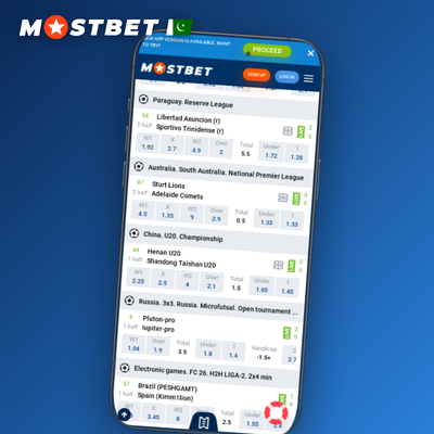 Smartphone showing the Mostbet mobile app lobby with a fingerprint login prompt